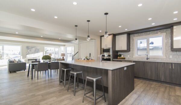 A beautiful shot of a modern house kitchen and dining room